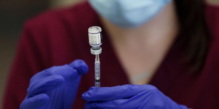 Omicron forces new restrictions, global call for booster shot