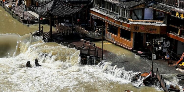 Hundreds of thousands evacuated in China amid heavy rains, floods