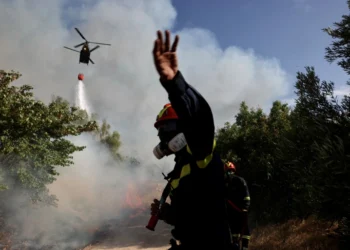 Residents evacuate as wildfire threatens homes near Athens