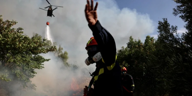 Residents evacuate as wildfire threatens homes near Athens