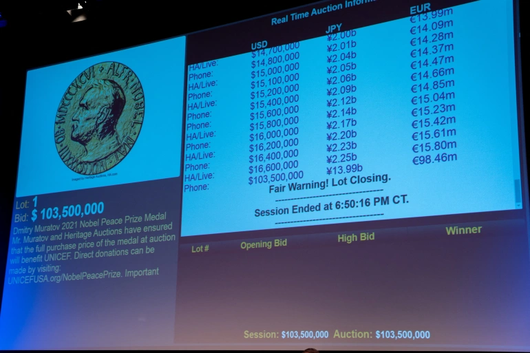 A projection of the final winning bid for Dmitry Muratov’s 2021 Nobel Peace Prize medal. The buyer has not been identified [David ‘Dee’ Delgado/Reuters]